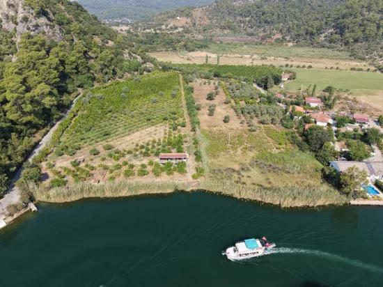 Село Köyceğiz в районе Çandır, у канала, 20.000м2 продажа поля
